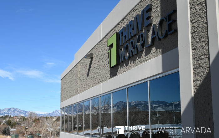 A Photo of Thrive Workplace West Arvada with the mountainscape and sign.